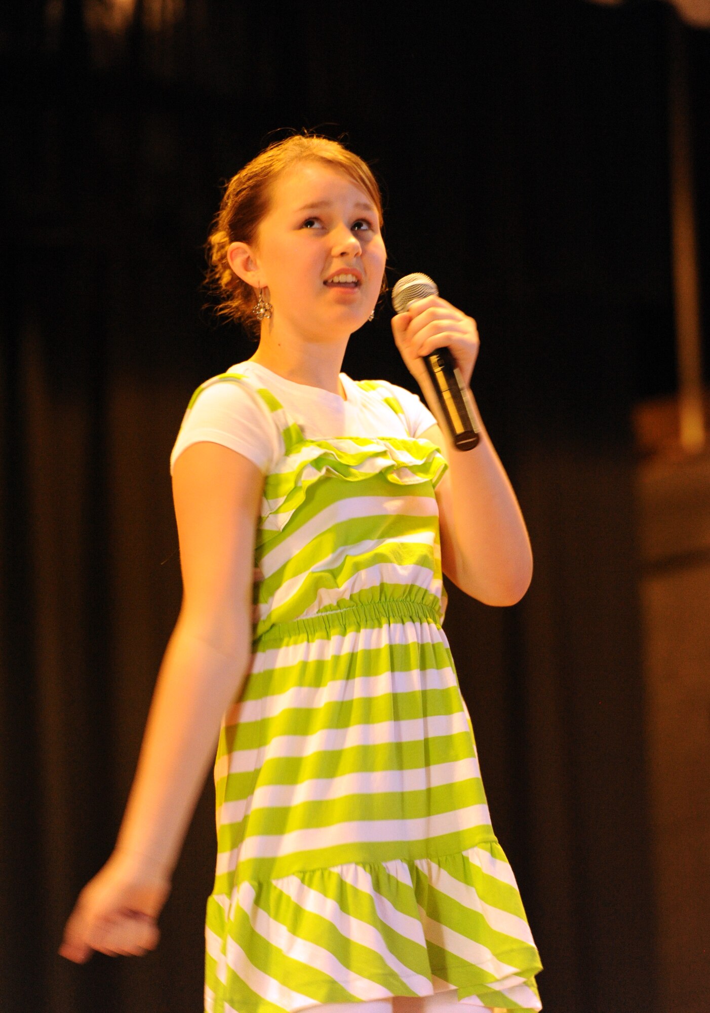 Cassidy Baugh sings Taylor Swift’s “Mean” to win first place in the “Teen Solo Vocal” category of the UGT (You Got Talent) competition on May 12, 2012, at Grand Forks Air Force Base, N.D.