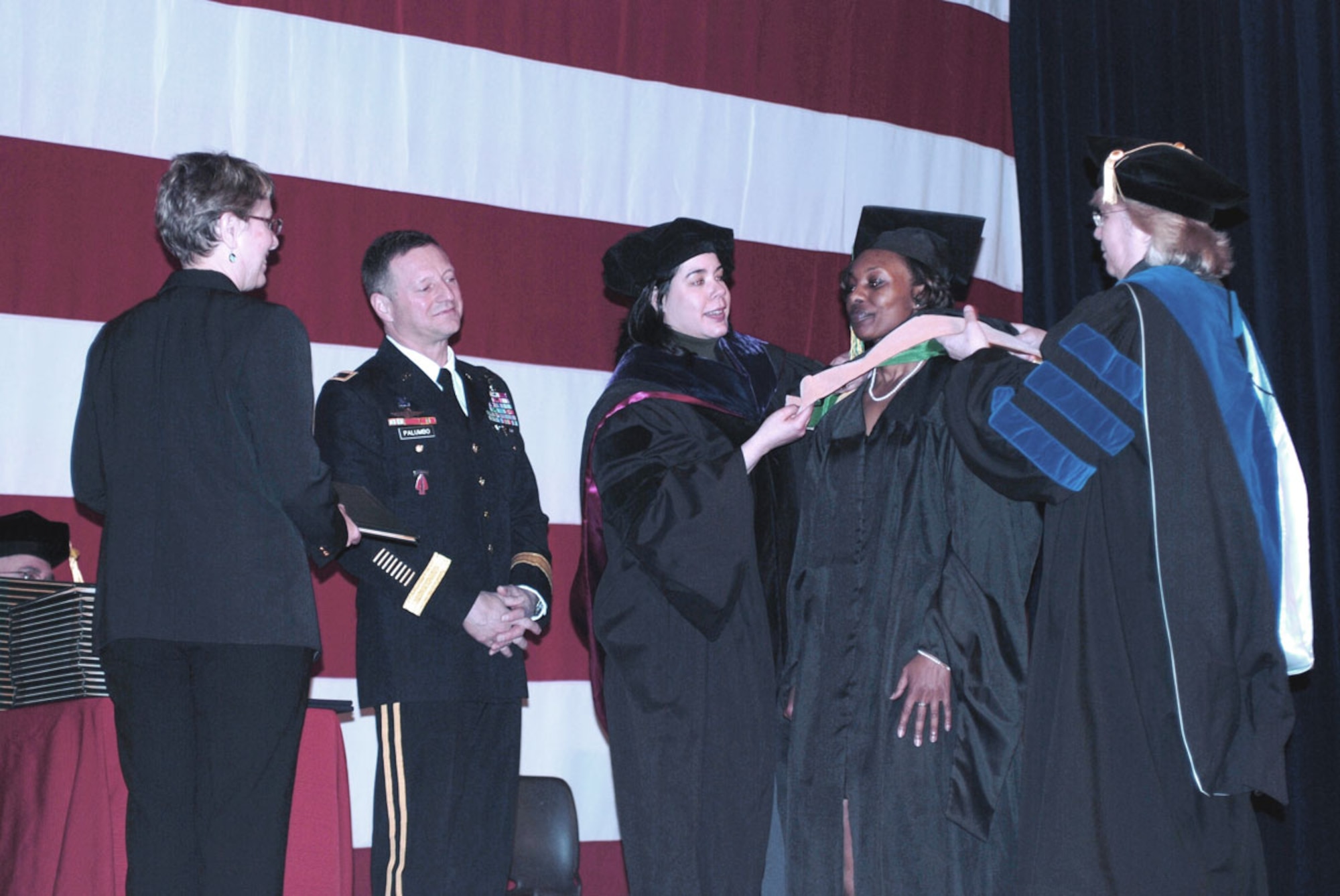 Honor graduates are recognized by Army Alaska Commander Maj. Gen. Raymond Palumbo and representatives from their universities during a May 4 ceremony on JBER honoring graduates who have earned academic degrees through the Army Continuing Education System. (U.S. Army photo/Staff Sgt. Matthew E. Winstead)
