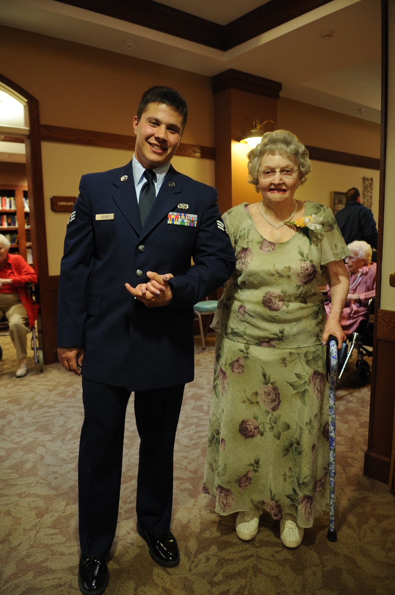 Senior Airman Michael Nelson, with the 319th Logistics Readiness Squadron at Grand Forks Air Force Base, N.D., poses for a photo with Leonara Wisener during the Senior Prom at Valley Memorial Homes-Woodside Village on April 27, 2012. Several Airmen from the base volunteered to serve as escorts at the event. (U.S. Air Force photo by Staff Sgt. Amanda N. Grabiec)