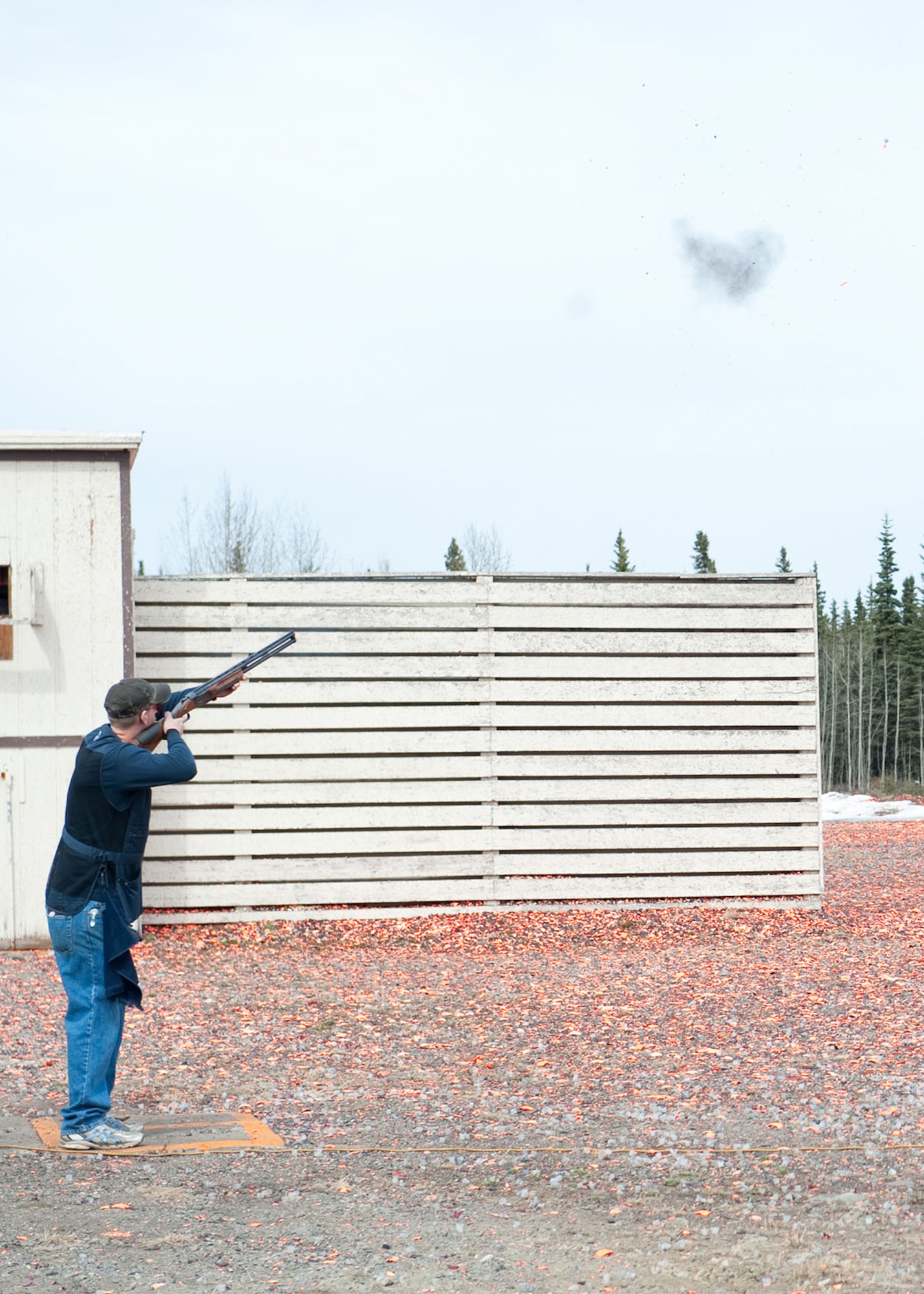 Air Force Staff Sgt. Albert Brown fires at a skeet during annual the Alaska Armed Forces Skeet Championships held at the Joint Base Elmendorf-Richardson Skeet and Trap Range May 5. The championship was held from 4-6 May and was open to military members, retired military and civilians. Brown serves as an Aerospace Maintenance Craftsman for the 962 Aircraft Maintenance Unit and is native to Redding, Calif. He is also the winner for the 12 gauge rounds. (U.S. Air Force photo/Staff Sgt. Robert Barnett)