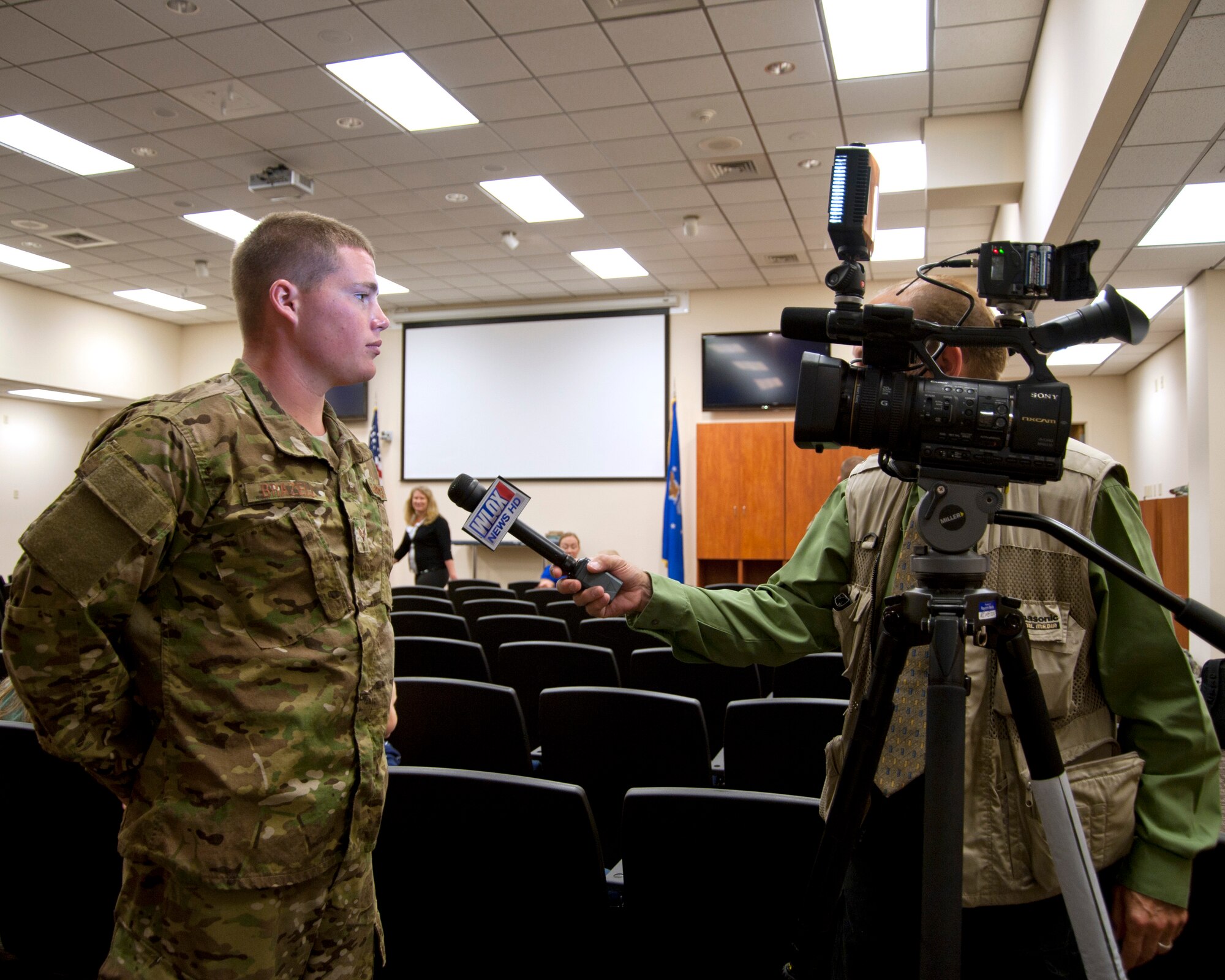 Senior Airman Jesse Brazell, 345th Maintenance, takes a few moments to answer questions about his role in the squadron's upcoming deployment to Southwest Asia.(U.S. Air Force photo by Maj. Heather Newcomb)