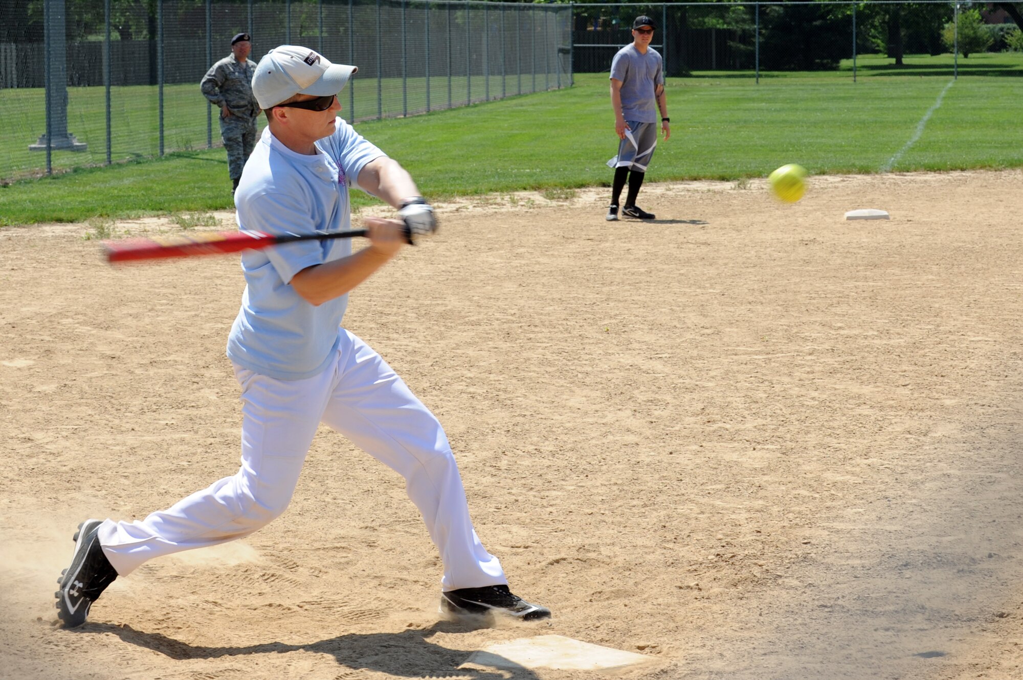 Staff Sgt. Matthew Noble, 375th Security Force Squadron security trainer, hits one out of the park during a softball tournament held by SFS for National Police Week at Scott's softball field , Ill, Apr. 28, 2012. In October 1969 President Kennedy signed a joint resolution declaring May 15th Peace Officers Memorial Day and the week that the 15th fell National Police Week. It is a time to honor those who have lost their lives or have became disabled in the line of duty.(U.S. Air Force photo/Staff Sgt. Teresa M. Jennings)