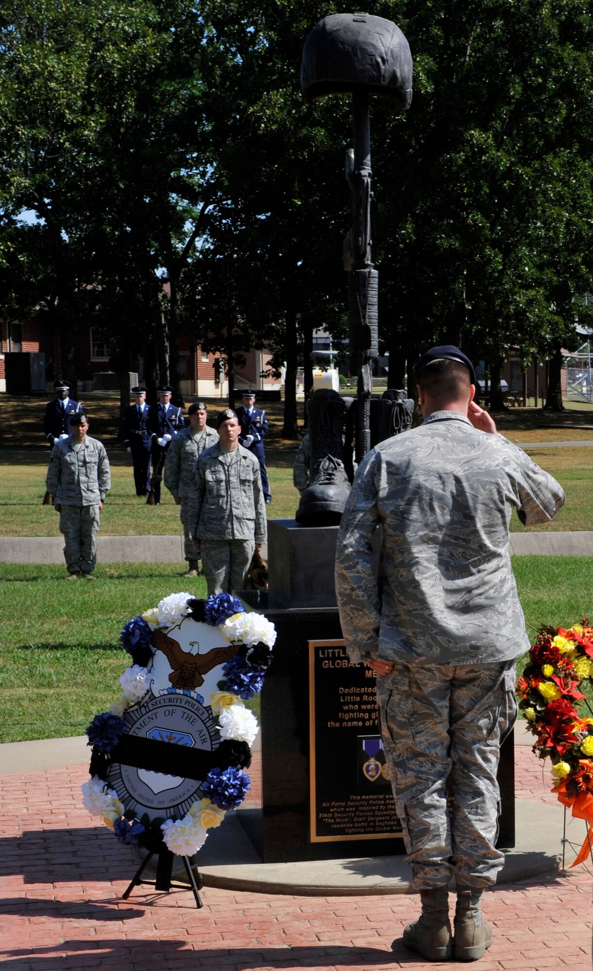 Maj. Peter Lex, 19th Security Forces Squadron commander, lays a wreath during the Global War on Terrorism Wreath Laying Ceremony May 17, 2012, at Little Rock Air Force Base, Ark. Lex laid a wreath for Staff Sgt. John Self, a 19th SFS member who passed away while supporting combat operations in Southwest Asia. (U.S. Air Force photo by Airman 1st Class Rusty Frank)