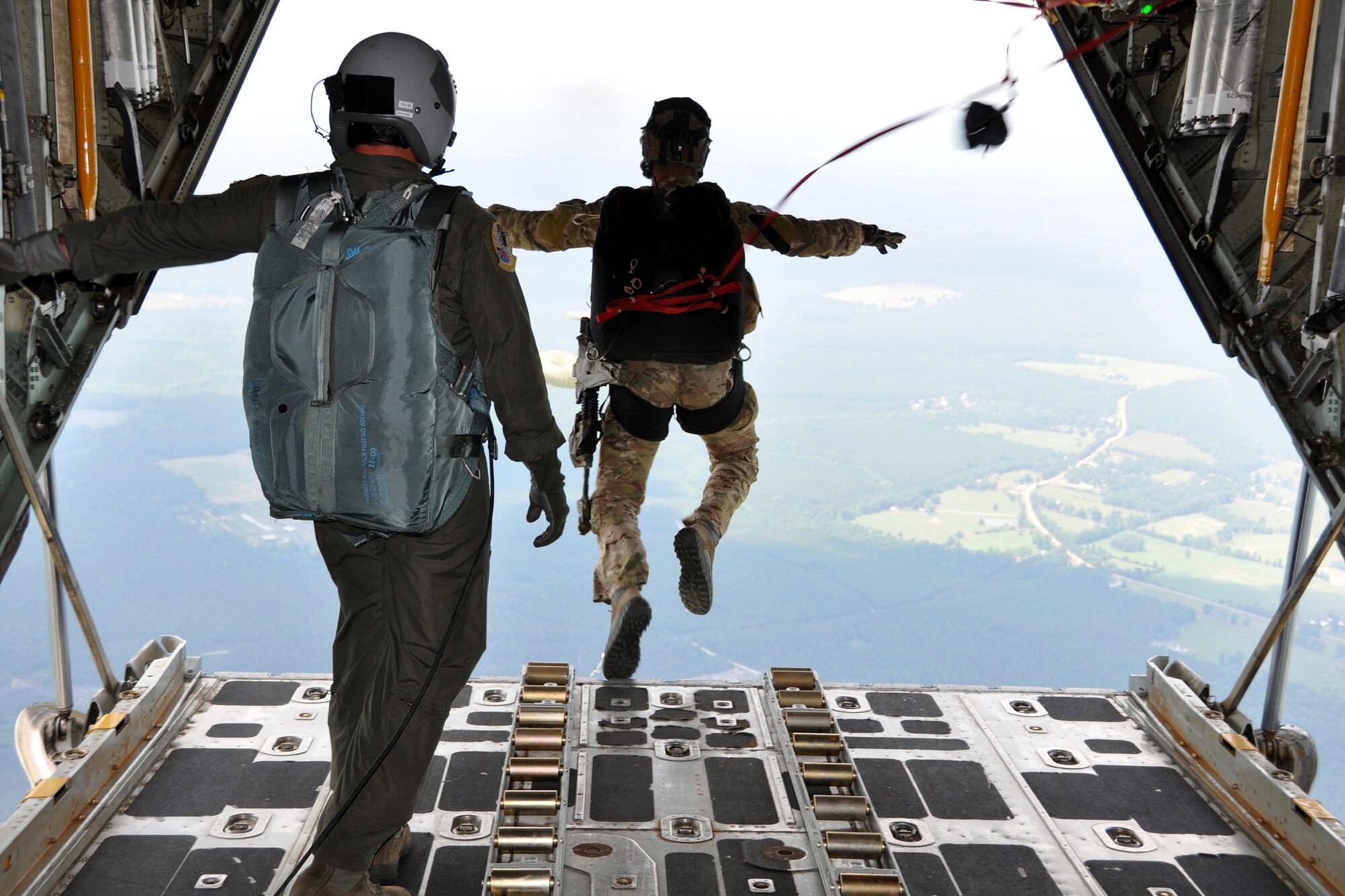 A Pararescueman from the 920th Rescue Wing, jumps from an HC-130 King to perform combat search and rescue(CSAR)  missions on Fort Polk, La., in support of the Patriot Saint exercise, May 16, 2012. Patriot Saint presents real-time, realistic CSAR scenarios and was conducted and led by Air Force Reserve Command's 10th Air Force. (U.S. Air Force photo by Master Sgt. Joshua Woods/Released)