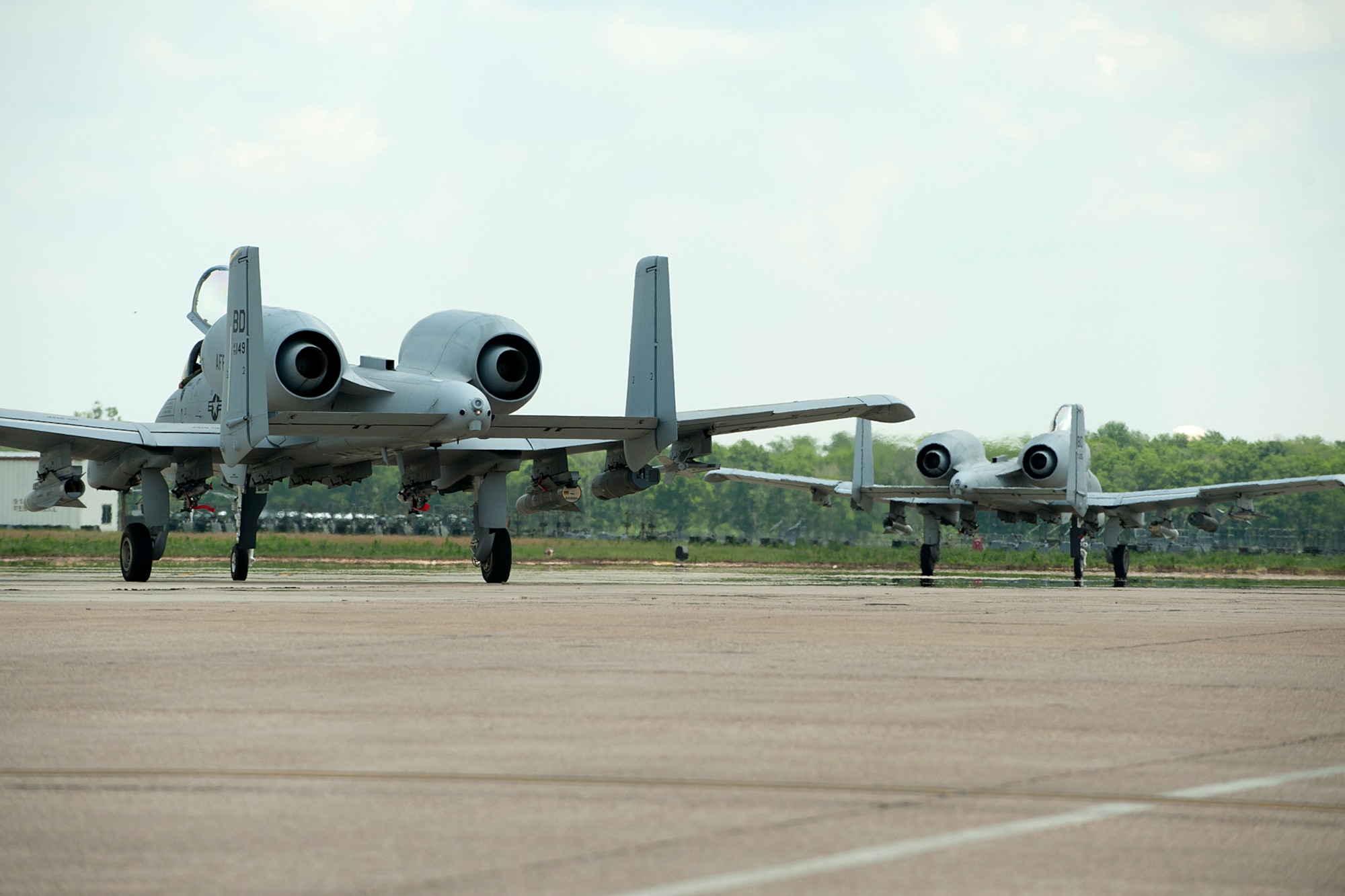 Two 47th Fighter Squadron A-10 Thunderbolt II aircraft taxi for a mission in support of the Patriot Saint exercise, Barksdale Air Force Base, La., May 16, 2012. The exercise presents real-time, realistic combat search and rescue missions and the job of the A-10 is to lead and support the effort to recover survivors and ground personnel. (U.S. Air Force photo by Master Sgt. Greg Steele/Released)