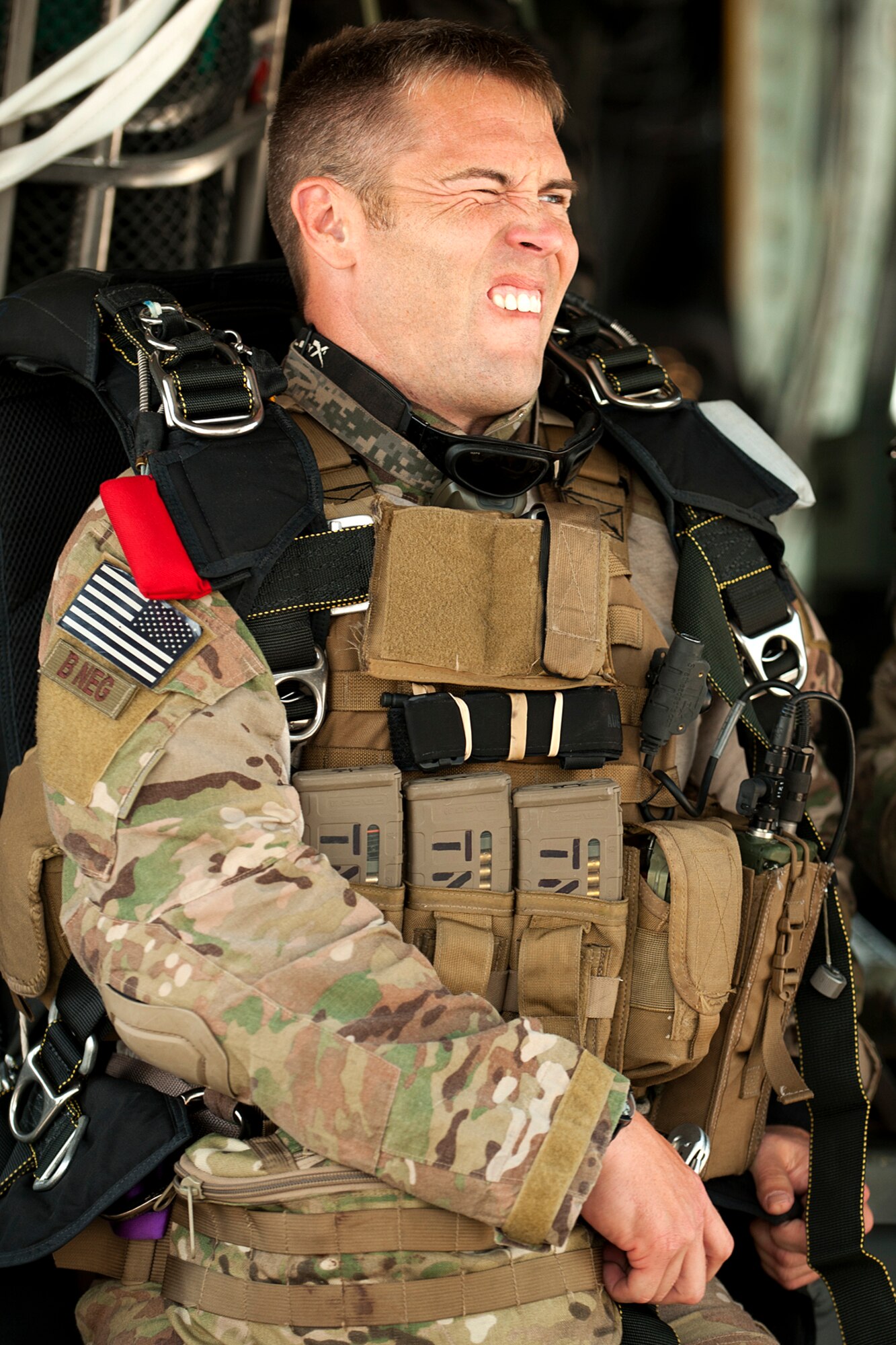 A 920th Rescue Wing pararescueman grimaces as he tightens up the leg straps on his parachute prior to a mission in support of the Patriot Saint exercise, Barksdale Air Force Base, La., May 16, 2012. The wing is bases at Patrick Air Force Base, Fla., and is an Air Force Reserve Command combat-search-and-rescue unit. (U.S. Air Force photo by Master Sgt. Greg Steele/Released)