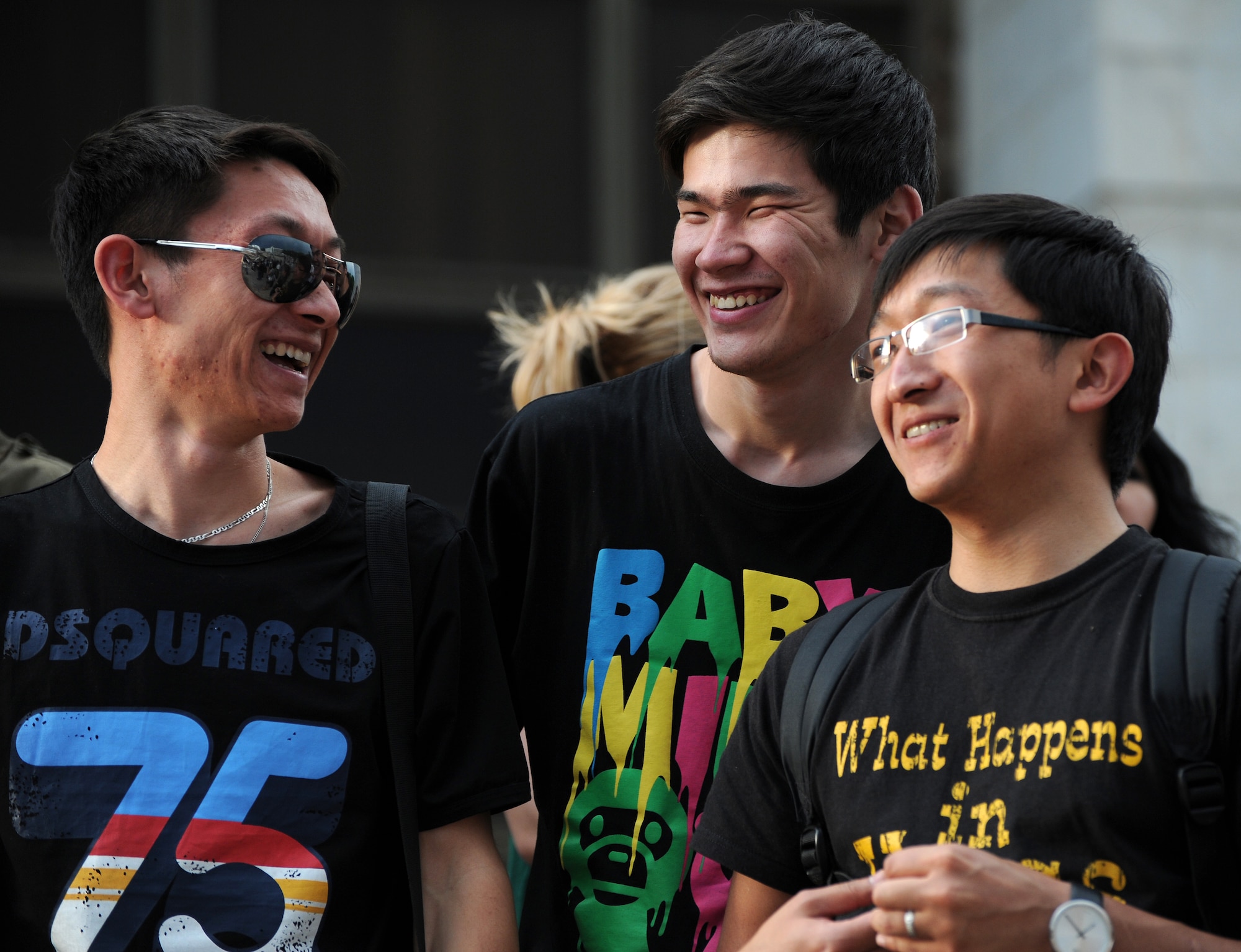 (r to l) Ruslan Kim, Tilek Bebykov and Maxim Kim enjoy music performed by the U.S. Air Forces Central Band "Night Wing" during a concert held on the steps of the Kyrgyz State Museum of History, Bishkek, Kyrgyzstan, May 16, 2012, in celebration of International Museum Day. Night Wing, deployed from Offutt Air Force Base, Neb., performed more than 20 songs for an audience of more than 2,000 people. (U.S. Air Force photo/Master Sgt. Tracy L. DeMarco)