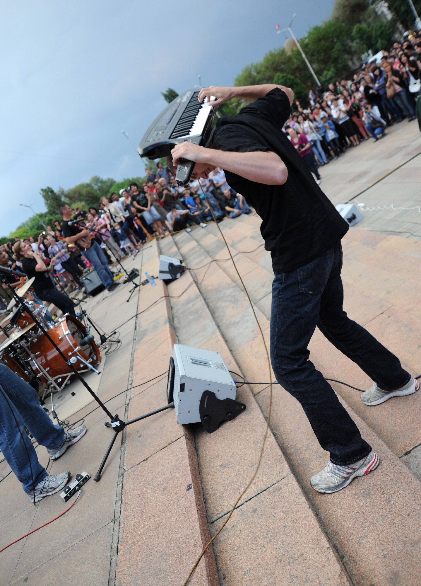 During a concert to celebrate International Museum Day, Senior Airman Ryan Rager, a keyboard player for the U.S. Air Forces Central Band "Night Wing" displays his skills while the band performs the song "Devil Went Down to Georgia" for an audience of more than 2,000 people in Ala Too Square, Bishkek, Kyrgyzstan, May 16, 2012. Night Wing was invited by Ms. Anarkul Isiralieva, the director of the Kyrgyz State Museum of History to help celebrate International Museum Day at the "Museum Night" event. (U.S. Air Force photo/Master Sgt. Tracy L. DeMarco)