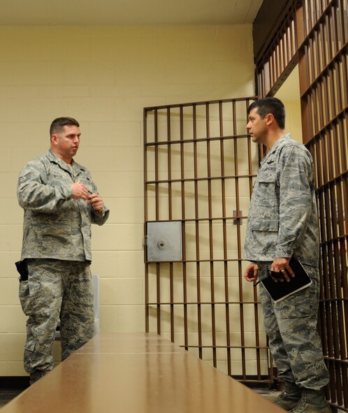 Col. Andrew Gebara, 2nd Bomb Wing commander, listens to Tech. Sgt. Jon Walsh, 2nd Security Forces Squadron, as he briefs about the recently built confinement facility on Barksdale Air Force Base, La., May 16. Gebara took part in an immersion tour to introduce himself as the new installation and wing commander. (U.S. Air Force photo/Airman 1st Class Andrew Moua)