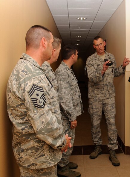 Maj. Mark Breed, 2nd Security Forces Squadron commander, briefs Col. Andrew Gebara, 2nd Bomb Wing commander, on the 2 SFS mission on Barksdale Air Force Base, La., May 16. Gebara took part in an immersion tour to introduce himself as the new installation and wing commander. (U.S. Air Force photo/Airman 1st Class Andrew Moua)
