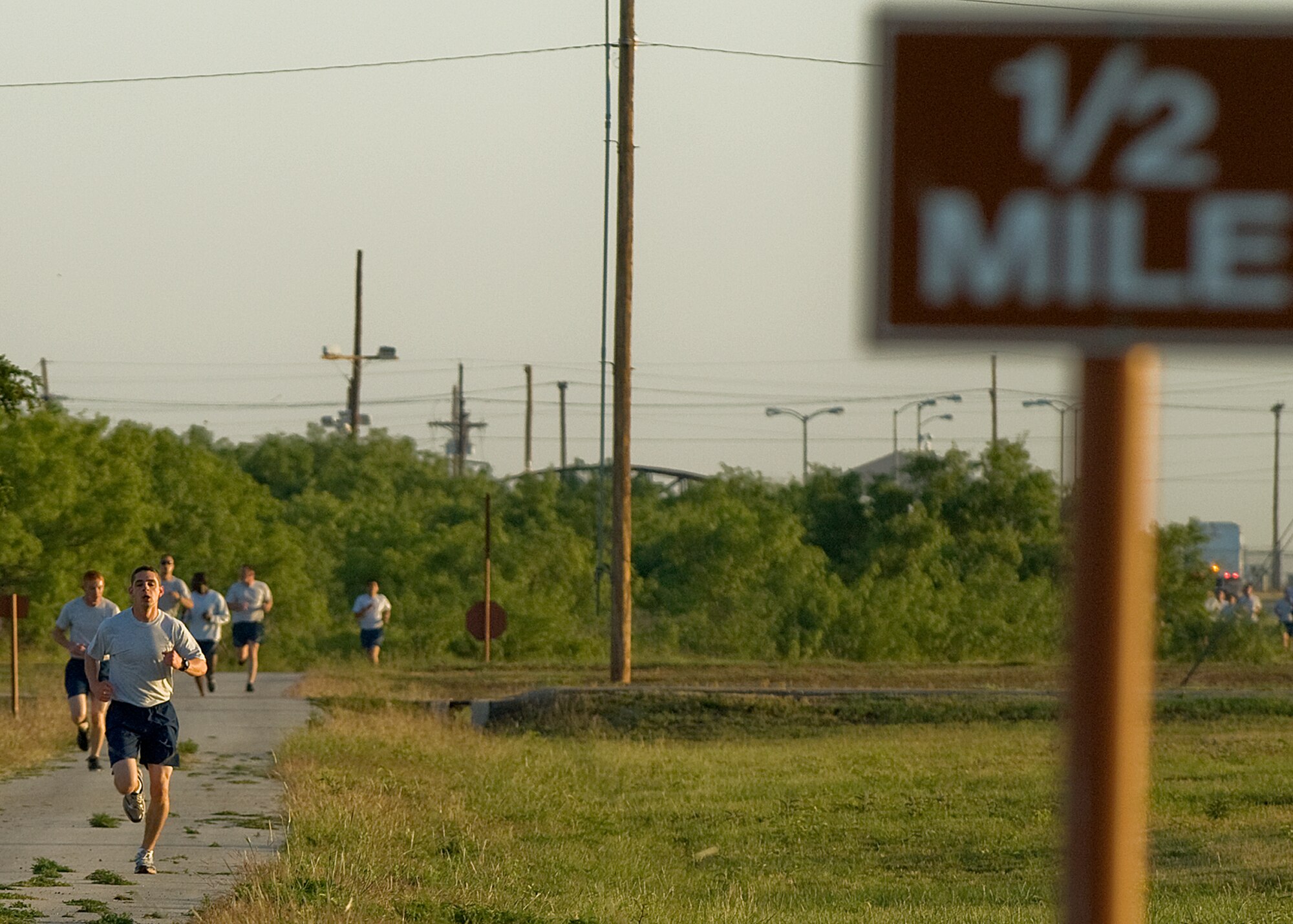Senior Airman Julian Alberni, 7th Civil Engineer Squadron, runs during a physical training session May 16, 2012, at Dyess Air Force Base, Texas. Of all the Dyess airmen to take a physical assessment this year, Alberni was the top overall performer. Alberni performed 67 push-ups and 60 sit-ups during his last physical assessment, scores that gave him the maximum points for those portions of the test. But where he really excelled was his run. He ran his 1.5 miles in 8:16. (U.S. Air Force photo by Airman 1st Class Damon Kasberg/Released)