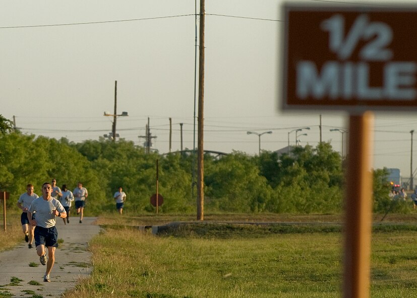 Senior Airman Julian Alberni, 7th Civil Engineer Squadron, runs during a physical training session May 16, 2012, at Dyess Air Force Base, Texas. Of all the Dyess airmen to take a physical assessment this year, Alberni was the top overall performer. Alberni performed 67 push-ups and 60 sit-ups during his last physical assessment, scores that gave him the maximum points for those portions of the test. But where he really excelled was his run. He ran his 1.5 miles in 8:16. (U.S. Air Force photo by Airman 1st Class Damon Kasberg/Released)