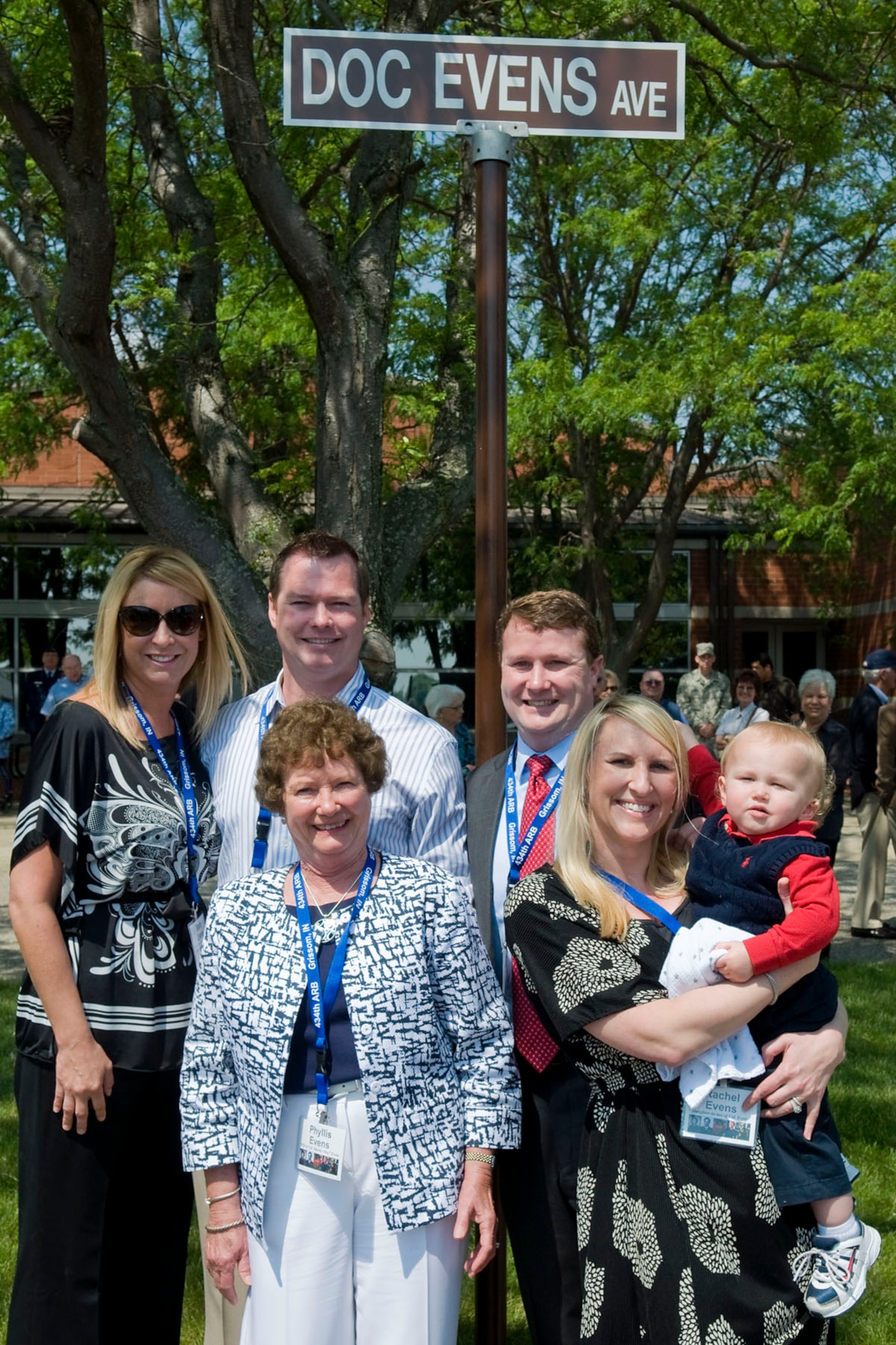 GRISSOM AIR RESERVE BASE, Ind. -- Col. (Dr.) Marvin Evens' family pose for a photo under a newly unveiled Doc Evens Avenue sign here May 14. Evens was a 930th Medical Group commander and A-10 pilot who lost his life when his A-10 crashed during a training mission near Grissom in 1992. From left are his daughter-in-law Barb, son Patrick, wife Phyllis, son Christopher, daughter-in-law Rachel and grandson Grant. (U.S. Air Force photo/Tech. Sgt. Mark R. W. Orders-Woempner)
