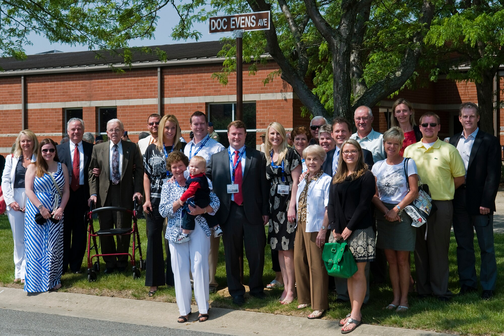 GRISSOM AIR RESERVE BASE, Ind. -- Col. (Dr.) Marvin Evens' family pose for a photo under a newly unveiled Doc Evens Avenue sign here May 14. Evens was a 930th Medical Group commander and A-10 pilot who lost his life when his A-10 crashed during a training mission near Grissom in 1992. (U.S. Air Force photo/Tech. Sgt. Mark R. W. Orders-Woempner)
