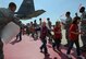 WHITEMAN AIR FORCE BASE, Mo. -- Children returning from their simulated deployment are greeted by a line of Airmen during Operation Spirit April 21. Operation Spirit is held annually to help children experience a “deployment” in a way they understand. (U.S. Air Force photo/Airman 1st Class Bryan Crane)(Released)