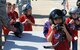 WHITEMAN AIR FORCE, Mo. -- Children from Operation Spirit try on pilot helmets on the flightline April 21. While on the flightline the children also had a chance to view Whiteman’s aircraft and board a C-130 Hercules. (U.S. Air Force photo/Airman 1st Class Bryan Crane)(Released)