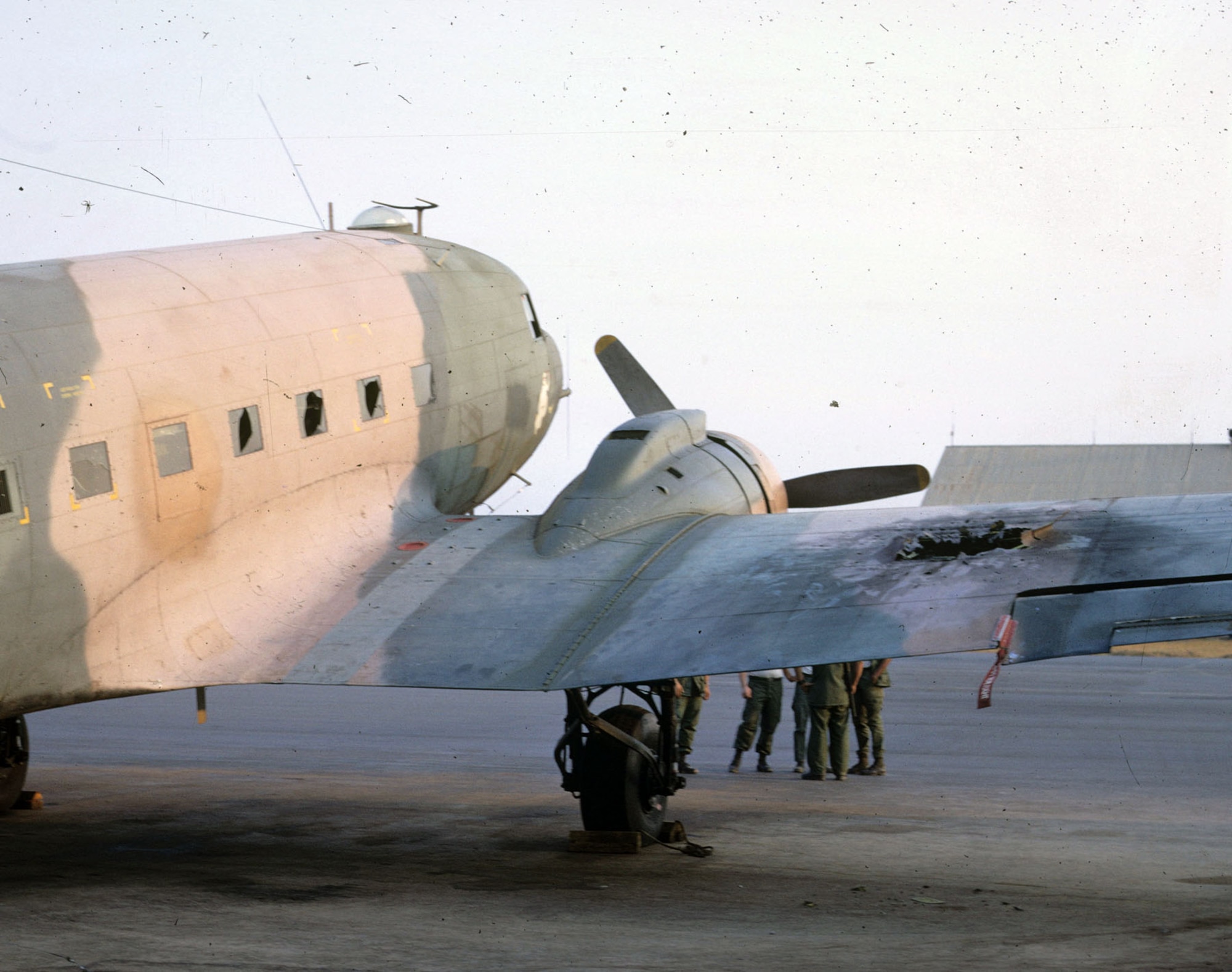 Spooky 71 the morning after Airman 1st Class John Levitow’s Medal of Honor mission. The mortar shell blew a hole through the right wing, shattered several windows and sent thousands of fragments into the fuselage. (U.S. Air Force photo)