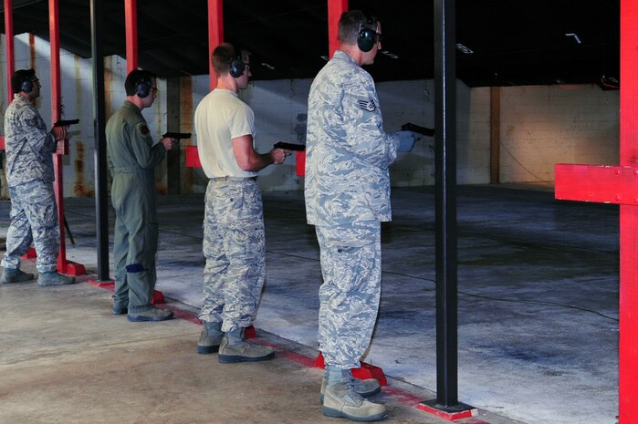 Military members out of Joint Base Charleston, S.C., shoot an M-9 during a shooting competition, May 16, 2012. Security Forces Combat Arms holds this shooting competition annually for for national police week to pay respects to fallen civilian and military police officers. (U.S. Air Force photo/ Airman 1st Class Chacarra Walker)
