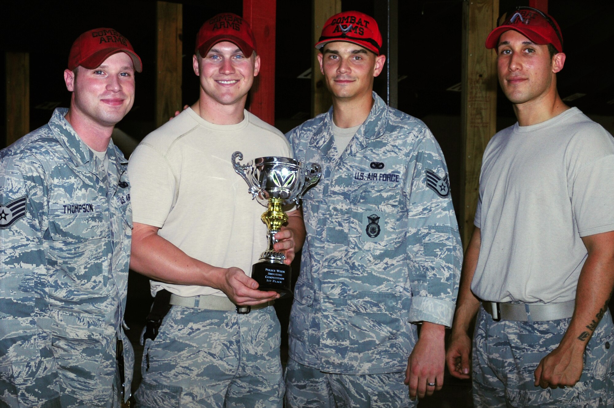 Memebrs from the 628th Security Forces Squadron, Combat Arms, out of Joint Base Charleston, S.C., poses for a picture, May 16, 2012. Security Forces Combat Arms holds this shooting competition annually for for national police week to pay respects to fallen civilian and military police officers. (U.S. Air Force photo/ Airman 1st Class Chacarra Walker)