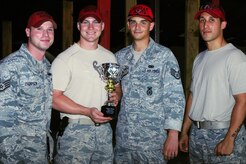 Members from the 628th Security Forces Squadron, Combat Arms, out of Joint Base Charleston, S.C., pose for a picture, May 16, 2012. Security Forces Combat Arms holds this shooting competition annually for national police week to pay respects to fallen civilian and military police officers. (U.S. Air Force photo/ Airman 1st Class Chacarra Walker)