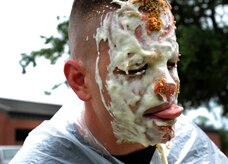 Senior Master Sgt. Jason Heilman, 628th Security Forces Squadron, gets a pie in the face May 16, 2012 at Joint Base Charleston, S.C. For the Pie-in-the-face Contest, personnel from the 628th SFS placed money down toward who they wanted to be picked. The highest and the lowest number of votes were the chosen ones. The money raised for this event will go toward the Special Olympics in South Carolina. (U.S. Air Force photo/Airman 1st Class Ashlee Galloway)