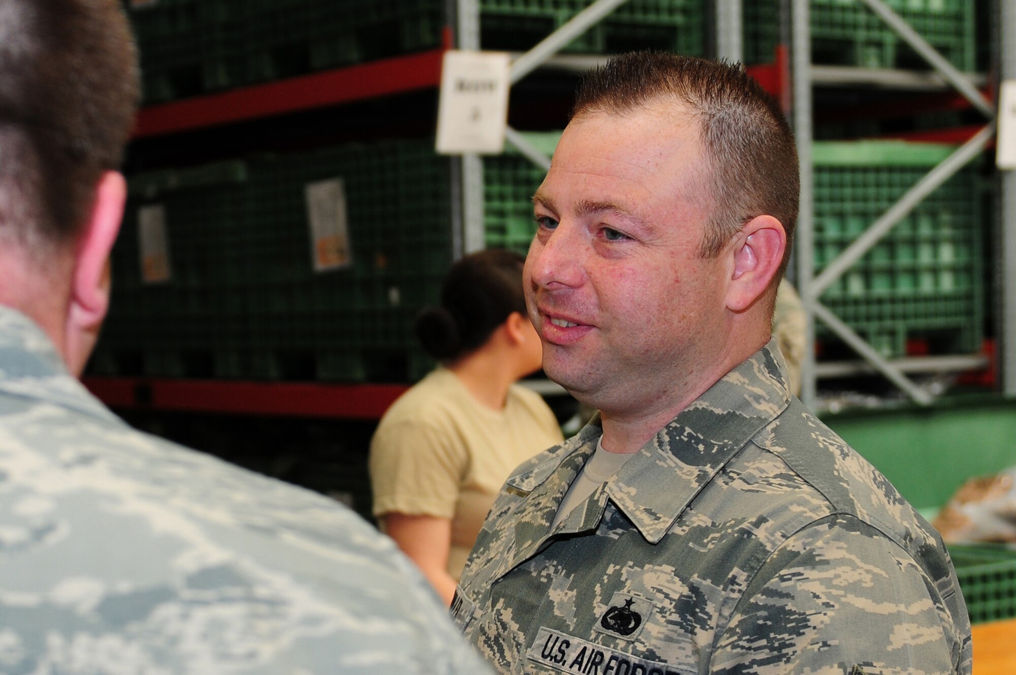 ROYAL AIR FORCE LAKENHEATH, England – Tech. Sgt. Jeremy Aumiller, 48th Force Support Squadron Airman & Family Readiness Center readiness NCO in charge, speaks to a re-deploying Airman in the mobility section of the Installation Deployment Readiness Center May 17, 2012. Aumiller was nominated for a Liberty Spotlight because he displays the core value of "Excellence in All We Do.” (U.S. Air Force photo by Airman 1st Class Cory D. Payne)