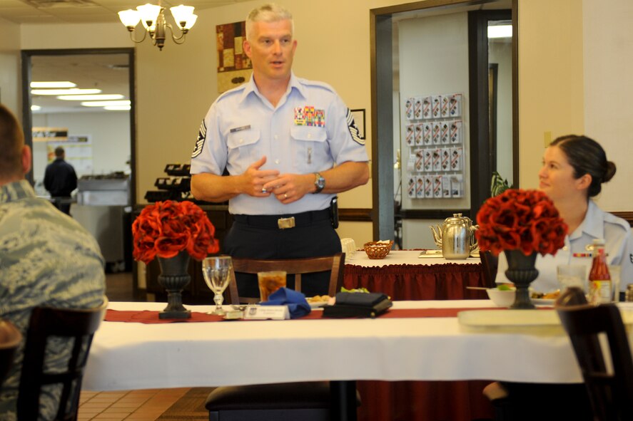 U.S. Air Force Chief Master Sgt. Robert Brooks, 9th Air Force command chief, introduces himself to Airmen at Moody Air Force Base, Ga., May 14, 2012. Brooks had lunch with Airmen and discussed ways to further their education. (U.S. Air Force photo by Airman 1st Class Douglas Ellis/Released) 
