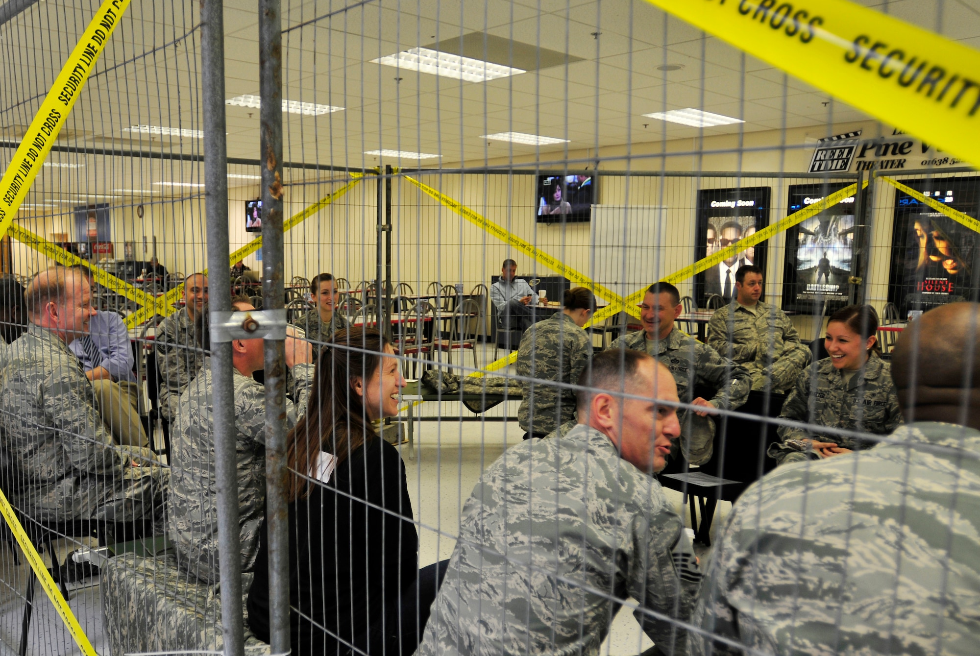 ROYAL AIR FORCE LAKENHEATH, England – Airmen and civilians sit in ‘jail’ at the Base Exchange during the ‘Jail & Bail’ fundraiser May 16, 2012. To raise money for the 48th Security Forces Squadron Defender Council, people donated money to ‘lock up’ co-workers, spouses, friends and more for up to a maximum of four hours, at the cost of $10 per hour. To get out of jail early, inmates had to pay double what was paid to lock them up. (U.S. Air Force photo by Senior Airman Tiffany M. Deuel)