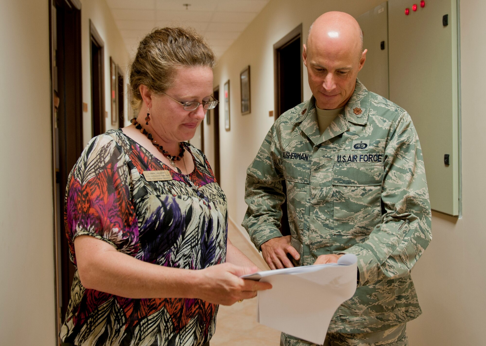 Maj. Thomas Ausherman, 39th Force Support Squadron commander, right, reviews paperwork with Carrie McGrew, 39th FSS force development flight chief, May 16, 2012, at Incirlik Air Base, Turkey. As the commander, Ausherman oversees five flights including manpower, Airman and family services, community services, sustainment, and force development. (U.S. Air Force photo by Senior Airman Anthony Sanchelli/Released)

