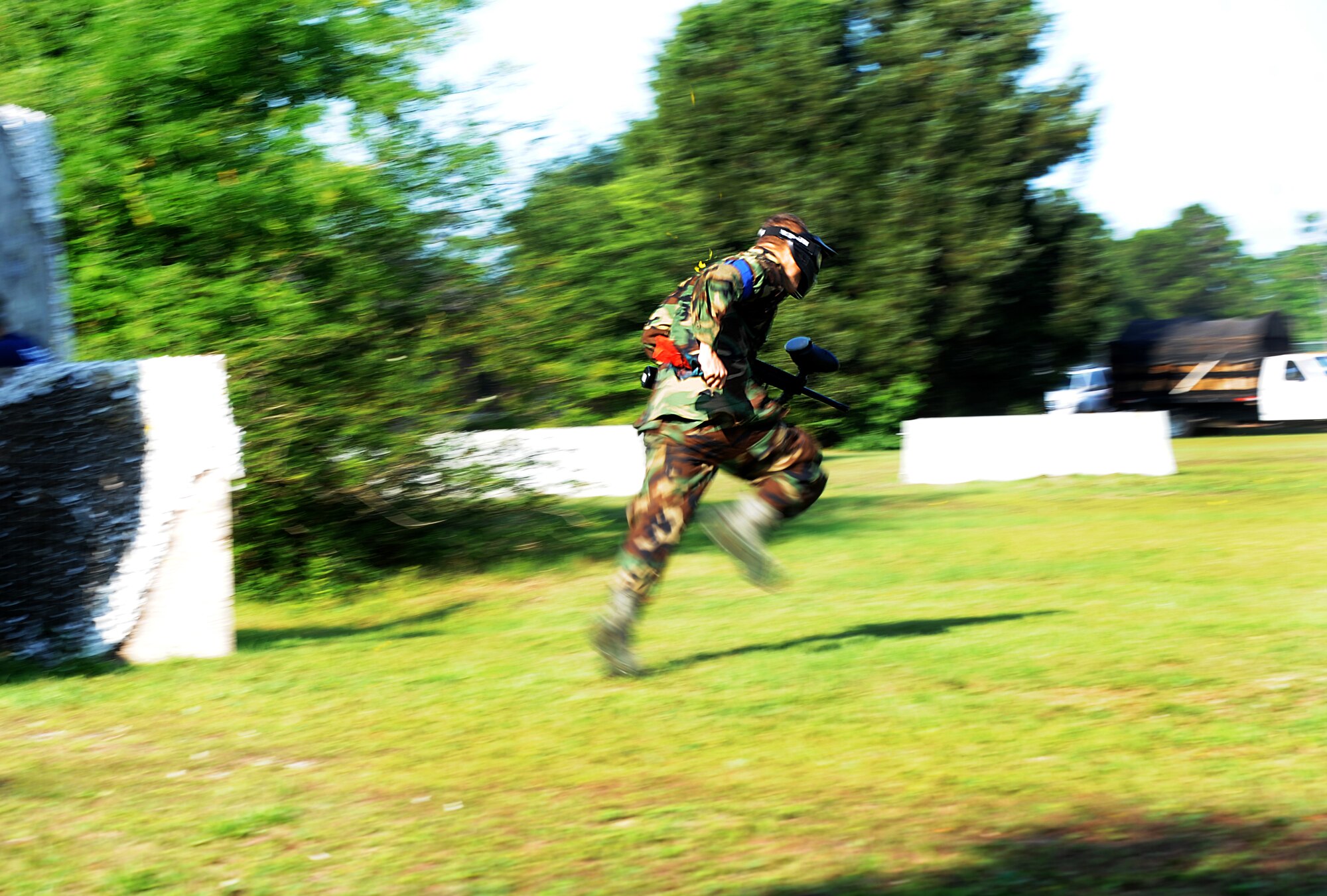 Airman 1st Class Andrew Bradley, 628th Civil Engineer Squadron firefighter, takes off during a paintball match against defenders from the 628th Security Forces Squadron during the "Guns and Hoses" fitness challenge, May 15 at Joint Base Charleston - Air Base, S.C. The 628th SFS hosted the firefighters in a day full of competition known as the "Guns and Hoses" fitness challenge. The competitions included a paintball match, defender ball and a softball game. The event kicked off National Police Week, which occurs annually during the week of May 15. National Police Week recognizes the service and sacrifice of U.S. law enforcement personnel. (U.S. Air Force photo/Airman 1st Class Ashlee Galloway)
 
