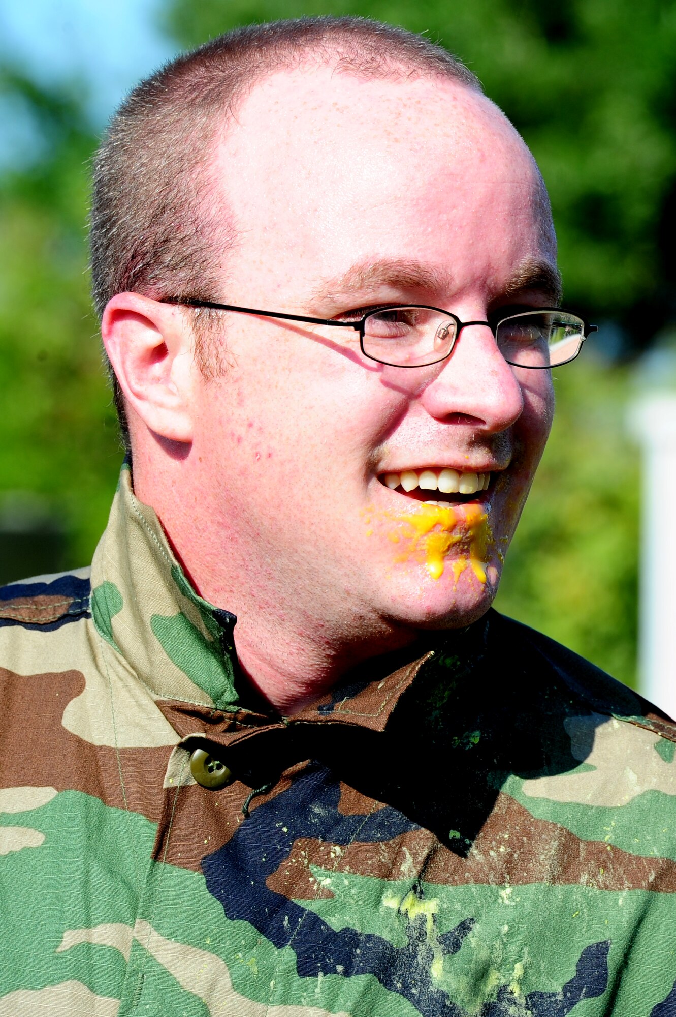 Senior Airman Craig Burnett, 628th Civil Engineer Squadron firefighter, shows off the paint on his face after a paintball match against defenders from the 628th Security Forces Squadron during the "Guns and Hoses" fitness challenge, May 15 at Joint Base Charleston - Air Base, S.C.  The 628th SFS hosted the firefighters in a day full of competition known as the "Guns and Hoses" fitness challenge.  The competition included a paintball match, defender ball and a softball game.  The event kicked off National Police Week, which occurs annually during the week of May 15.  It recognizes the service and sacrifice of U.S. law enforcement personnel.  (U.S. Air Force photo/ Staff Sgt. Nicole Mickle)  
 
