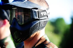 Airman 1st Class Andrew Bradley, 628th Civil Engineer Squadron firefighter, gets ready before a paintball match against defenders from the 628th Security Forces Squadron during the "Guns and Hoses" fitness challenge, May 15, 2012 at Joint Base Charleston, S.C. The 628th SFS hosted the firefighters in a day full of competition known as the "Guns and Hoses" fitness challenge. The competition included a paintball match, defender ball and a softball game. The event kicked off National Police Week, which occurs annually during the week of May 15. It recognizes the service and sacrifice of U.S. law enforcement personnel. (U.S. Air Force photo/Staff Sgt. Nicole Mickle)
