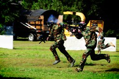 Firefighters from the 628th Civil Engineer Squadron take off during a paintball match against defenders from the 628th Security Forces Squadron while competing in the "Guns and Hoses" fitness challenge, May 15, 2012 at Joint Base Charleston, S.C. The 628th SFS hosted the firefighters in a day full of competition known as the "Guns and Hoses" fitness challenge. The competition included a paintball match, defender ball and a softball game. The event kicked off National Police Week, which occurs annually during the week of May 15. It recognizes the service and sacrifice of U.S. law enforcement personnel. (U.S. Air Force photo/ Staff Sgt. Nicole Mickle) 

