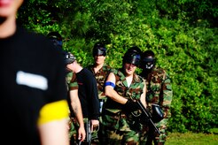 Firefighters from the 628th Civil Engineer Squadron get ready for a paintball match against defenders from the 628th Security Forces Squadron during the "Guns and Hoses" fitness challenge, May 15, 2012 at Joint Base Charleston, S.C. The 628th SFS hosted the firefighters in a day full of competition known as the "Guns and Hoses" fitness challenge. The competition included a paintball match, defender ball and a softball game. The event kicked off National Police Week, which occurs annually during the week of May 15. It recognizes the service and sacrifice of U.S. law enforcement personnel. (U.S. Air Force photo/Staff Sgt. Nicole Mickle)