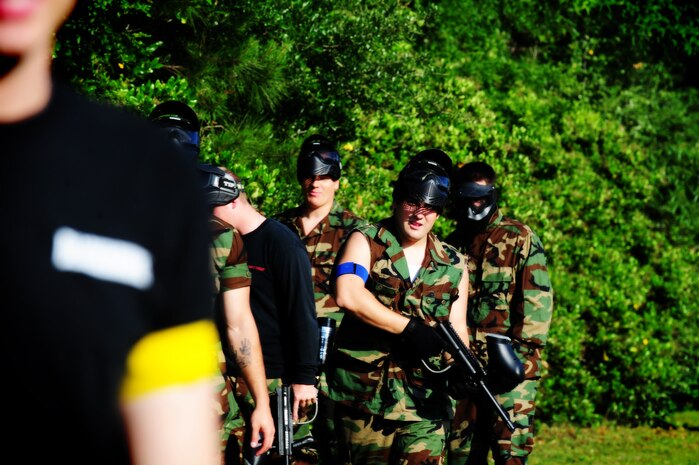 Firefighters from the 628th Civil Engineer Squadron  get ready for a paintball match against defenders from the 628th Security Forces Squadron during the "Guns and Hoses" fitness challenge, May 15 at Joint Base Charleston - Air Base, S.C.  The 628th SFS hosted the firefighters in a day full of competition known as the "Guns and Hoses" fitness challenge.  The competition included a paintball match, defender ball and a softball game.  The event kicked off National Police Week, which occurs annually during the week of May 15.  It recognizes the service and sacrifice of U.S. law enforcement personnel.  (U.S. Air Force photo/ Staff Sgt. Nicole Mickle) 