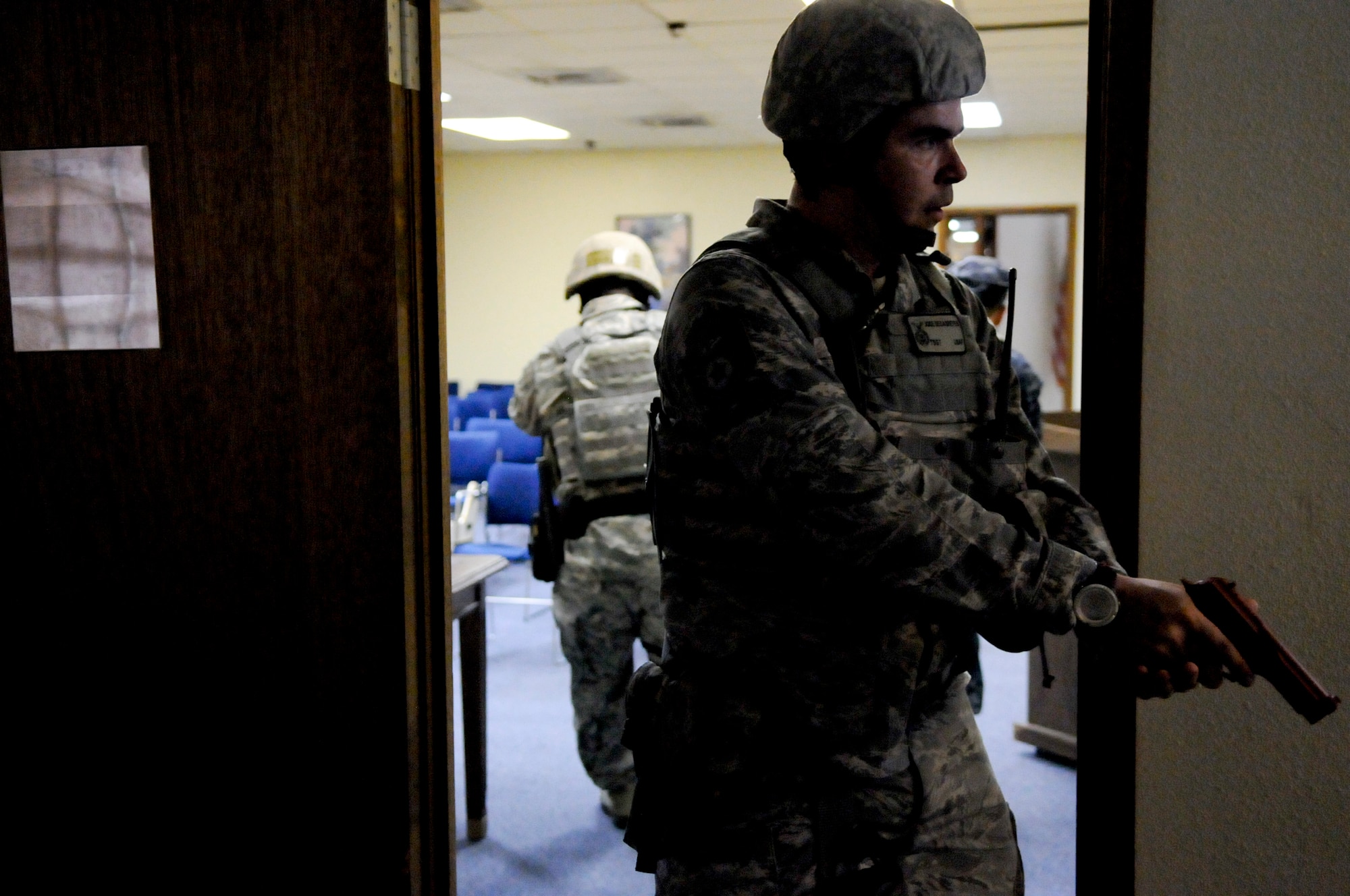 U.S. Air Force Tech. Sgt. Jose Sedasreves, 18th Security Forces Squadron member, maintains watch at the entrance to a room in a building attacked in an active shooter scenario during local operational readiness exercise Beverly High 12-4 on Kadena Air Base, Japan, May 16, 2012. Clearing rooms after an attack is a critical job of 18th SFS members to ensure the building is secure. (U.S. Air Force photo/Airman Tara A. Williamson)