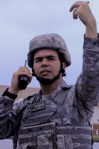 U.S. Air Force Tech. Sgt. Jose Sedasreves, 18th Security Forces Squadron member, rallies other members to one point to review an entry plan of an active shooter scenario during local operational readiness exercise Beverly High 12-4 on Kadena Air Base, Japan, May 16, 2012. Scenarios involving emergency responders are critical during LOREs to provide training for not only active shooter scenarios, but also other possible contingencies. (U.S. Air Force photo/Airman Tara A. Williamson)