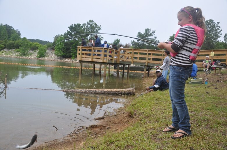 CALHOUN FALLS, S.C. — Kansas Belk of Greenwood, S.C., reels in a catfish at the 24th Annual Kid's Fishing Derby at Richard B. Russell Lake, May 12, 2012.