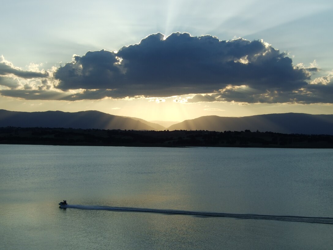 A solitary boater enjoys sundown at Black Butte Lake.