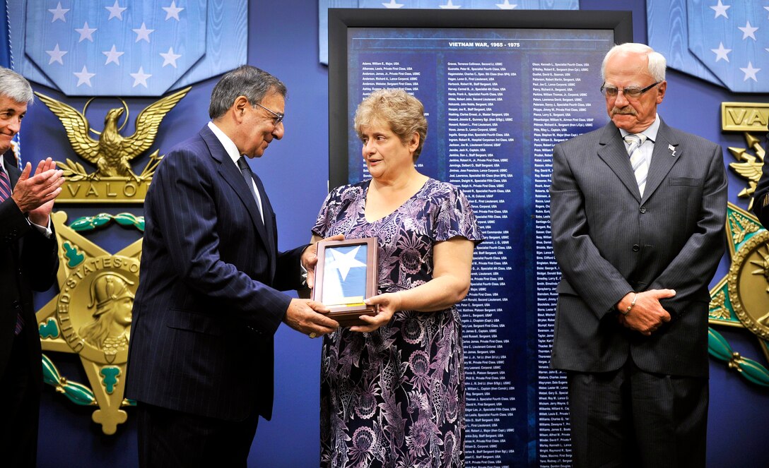 Defense Secretary Leon E. Panetta presents the Medal of Honor Flag to Rose Mary Sabo-Brown, widow of Army Medal of Honor recipient Army Spc. 4 Leslie H. Sabo Jr., and George Sabo, Sabo's brother, during the ceremony to posthumously induct the Vietnam-era soldier into the Hall of Heroes at the Pentagon, May 17, 2012.


the Medal of Honor induction ceremony in honor of Army Spc. 4, Leslie H. Sabo Jr. in the Hall of Heroes at the Pentagon, May 17, 2012. 
