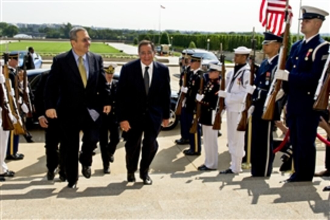 U.S. Defense Secretary Leon E. Panetta escorts Israeli Defense Minister Ehud Barak through an honor cordon into the Pentagon, May 17, 2012.