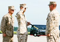 Sgt. Maj. Williams F. Squires, former Marine Corps Air Station New River sergeant major, salutes Col. Jeffrey M. Hewlett, air station commanding officer, before passing off the Sword of Office to the oncoming sergeant major, Sgt. Maj. Robert A. Allen, Jr., May 4. Squires retired after 30 years of honorable service and received the Legion of Merit from President Barack Obama for his exceptionally meritorious conduct in the performance of outstanding service.