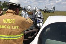 Aircraft Rescue and Firefighting Marines aboard Marine Corps Air Station New River are taught new techniques of vehicle extrication when conventional means are not possible, April 24. The Marines were reminded that an accident site will never be a picture-perfect job and they will most likely always have to think outside the box.