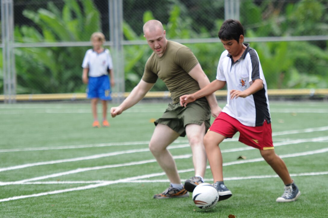 Cpl. Robert Erickson plays soccer during a volunteer project at a school here May 18. Erickson hails from Anchorage, Alaska, and serves as a rifleman for Battalion Landing Team 3/1, the ground combat element for the 11th Marine Expeditionary Unit. The unit embarked USS Makin Island, USS New Orleans and USS Pearl Harbor in San Diego Nov. 14, beginning a seven-month deployment to the Western Pacific, Horn of Africa and Middle East regions.