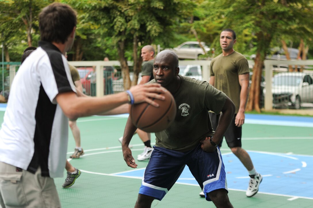 Lance Cpl. James Tima plays basketball during a volunteer project at a school here May 18. Tima hails from Miami and serves as a rifleman for Battalion Landing Team 3/1, the ground combat element for the 11th Marine Expeditionary Unit. The unit embarked USS Makin Island, USS New Orleans and USS Pearl Harbor in San Diego Nov. 14, beginning a seven-month deployment to the Western Pacific, Horn of Africa and Middle East regions.