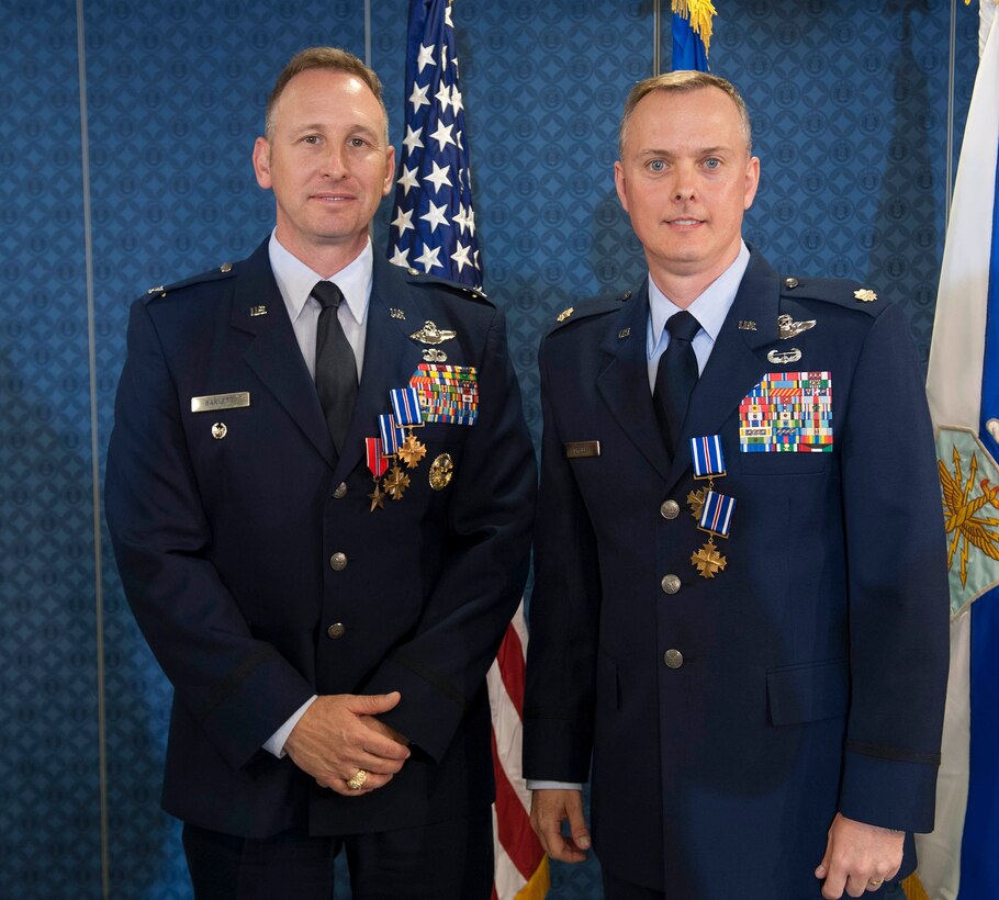 Air Force Chief of Staff Gen. Norton Schwartz presented two Distinguished Flying Cross with Valor medals and the Bronze Star to Col. Christopher Barnett (left), and two Distinguished Flying Cross with Valor medals to Maj. John Creel (right) during a ceremony in the Pentagon on May 18, 2012. (U.S. Air Force photo/Jim Varhegyi)