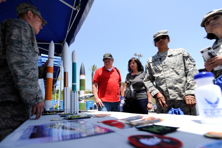 TORRANCE, Calif. -- 2nd Lt. Brad Pingel, 2nd Range Operations Squadron range control officer, informs military members and the public about Vandenberg's launch mission during the 53rd Annual Armed Forces Day here Friday, May 18, 2012. Military displays varied from rockets to tanks and were open for the public. (U.S. Air Force photo/Staff Sgt. Andrew Satran) 


 