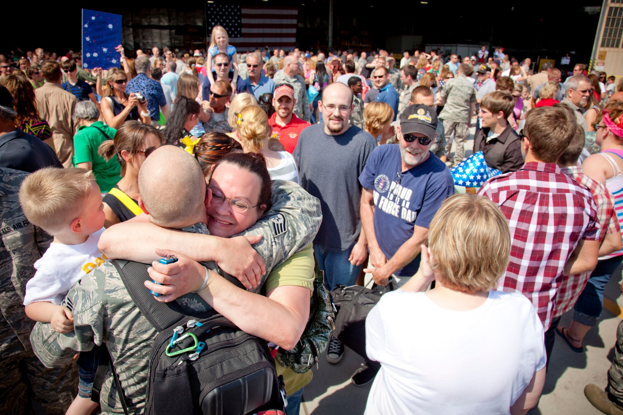 Friends and families reunite with Airmen of the 934th Airlift Wing as they return from overseas.  The Airmen have been deployed since early 2012 from the Minneapolis-St. Paul Air Reserve Station, Minn.  (U.S. Air Force Photo/Shannon McKay)