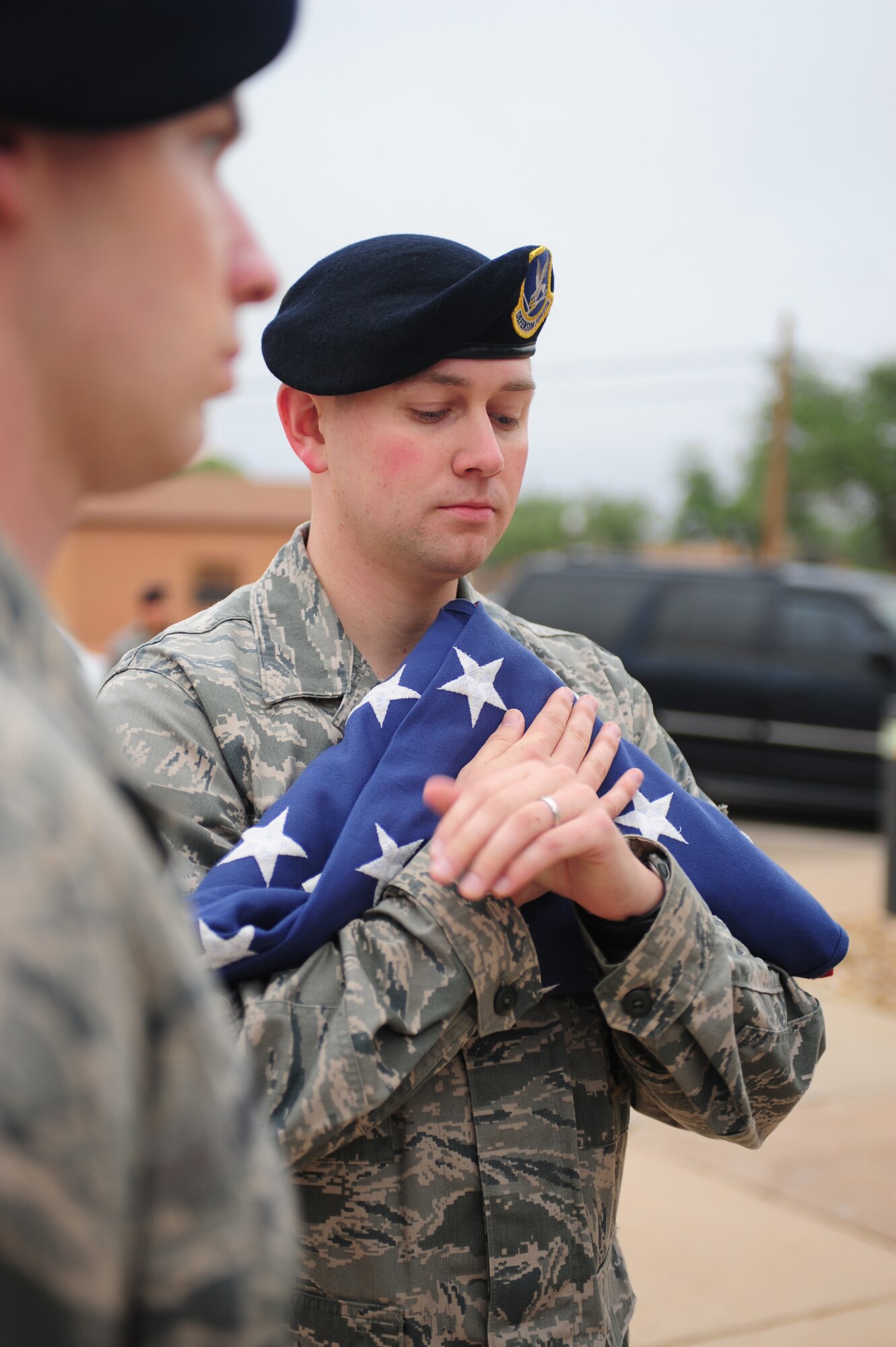 U.S. Air Force, Staff Sgt. Adam Dederick, 27th Special Operations Security Forces Squadron, checks his watch before the reveille ceremony in honor of National Police Week at Cannon Air Force Base, N.M., May 14, 2012. National Police Week is a collaborative effort of many organizations dedicated to honoring America’s law enforcement community. (U.S. Air Force photo by Airman 1st Class Eboni Reece)