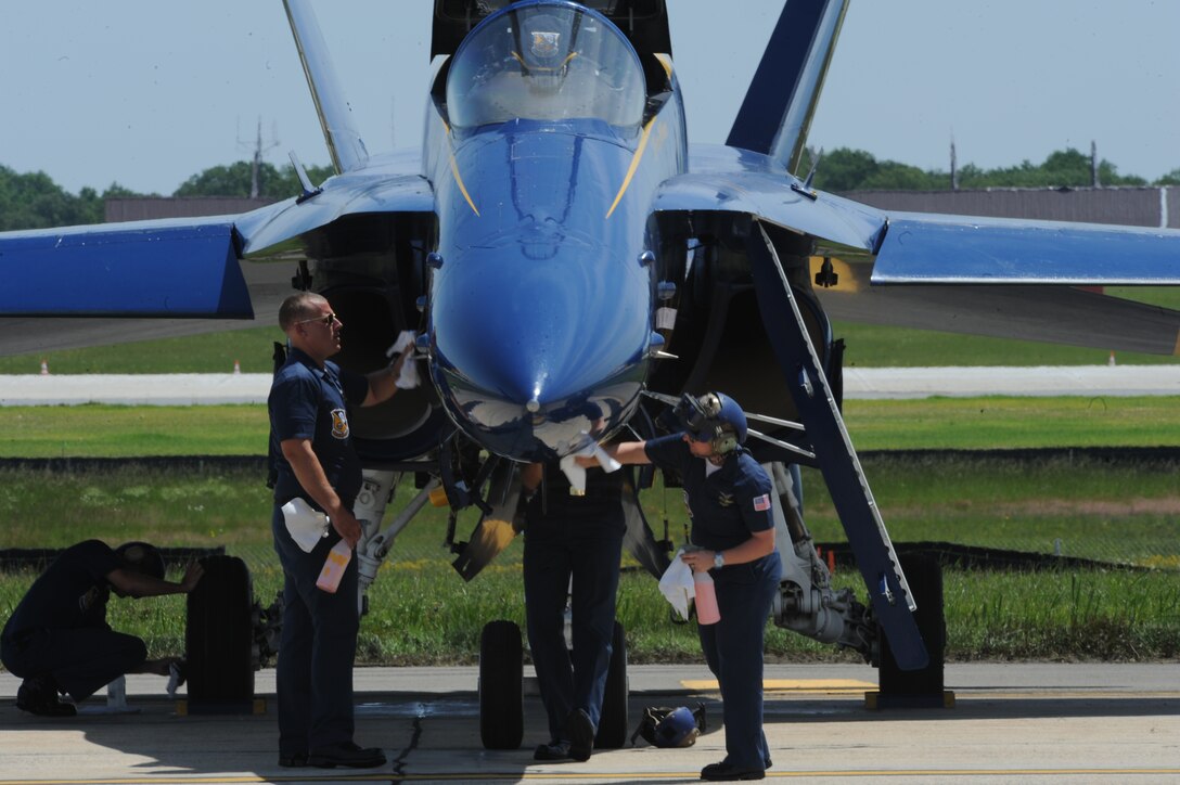 U.S. Navy Blue Angels maintainers prepare their F/A-18 for it’s performance at Joint Base Andrews, May 18. This year’s Joint Service Open House (JSOH) celebrates the Centennial of Marine Corps Aviation. JSOH affords the public an opportunity to meet the men and women of the Armed Forces while seeing over 100 static displays and 19 aerial demonstration teams. (U.S. Air Force photo/Airman 1st Class Aaron Stout)
